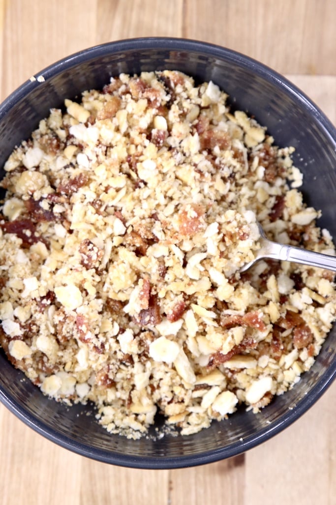 Bowl of crushed ritz crackers, bacon and butter