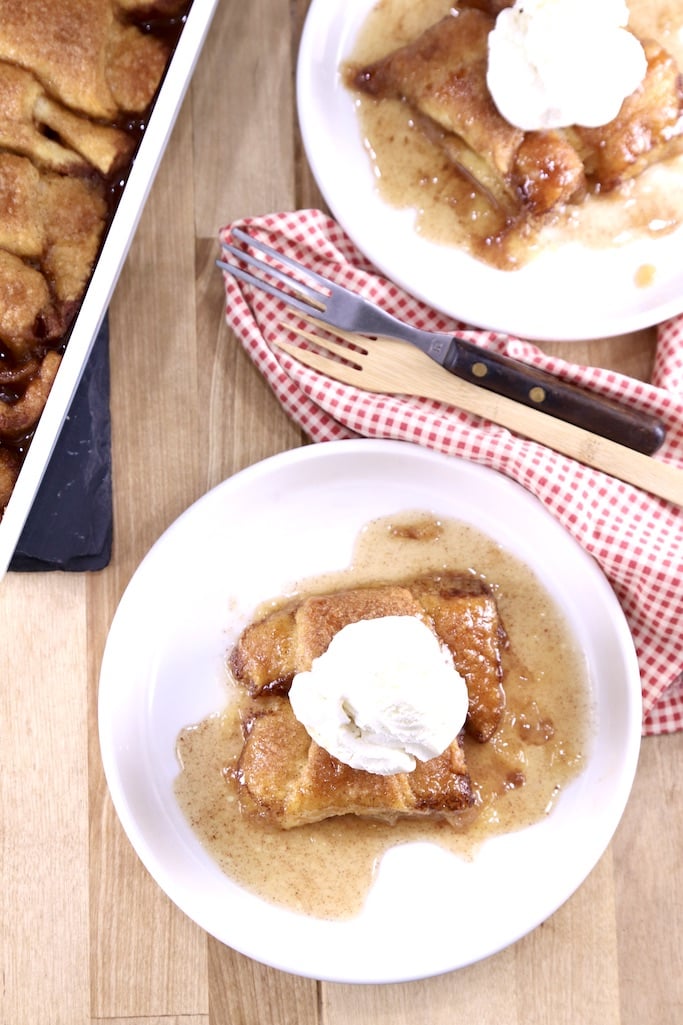Apple Dumplings on a plate topped with vanilla ice cream