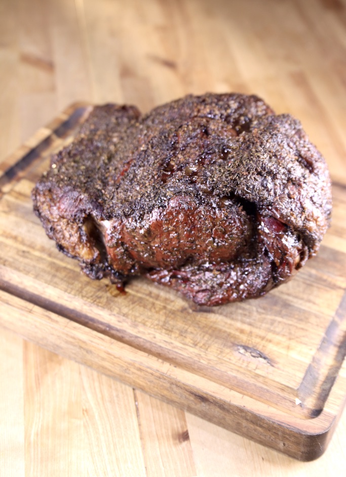 Garlic and Herb Prime Rib Roast - grilled on a cutting board