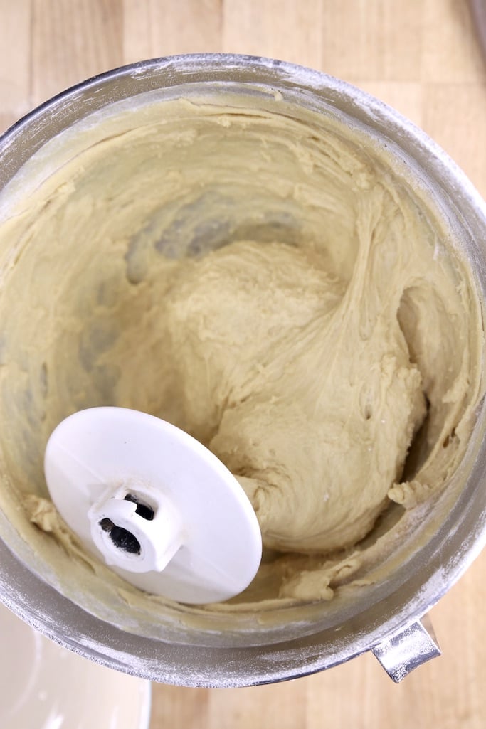 Dough hook in a bowl of bread dough