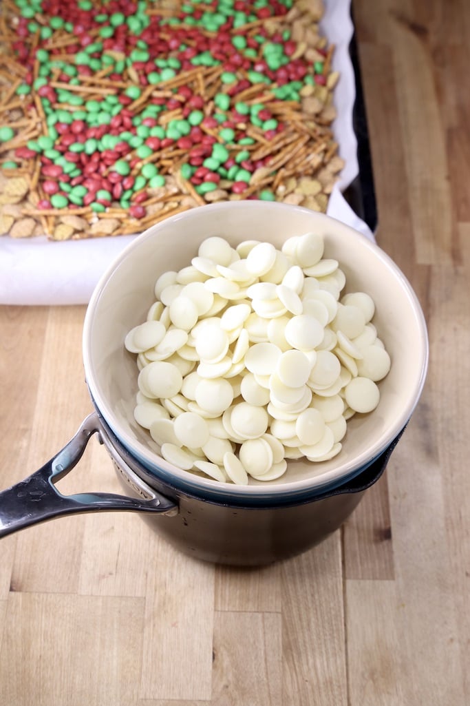 bowl of white melting wafers in a bowl over a pot - to melt
