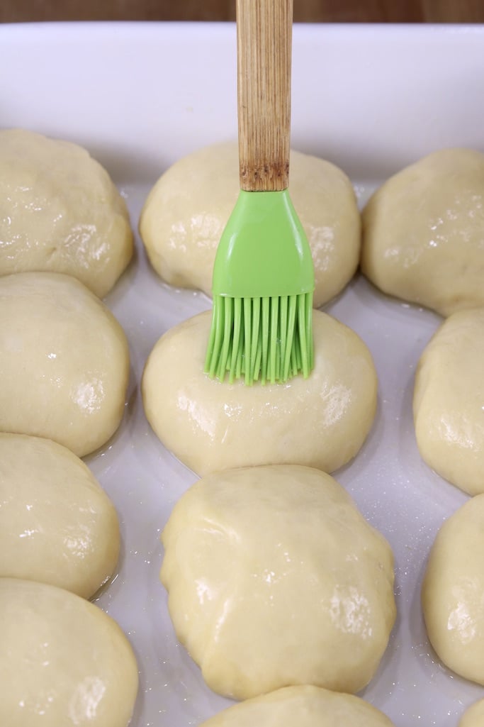 brushing dinner rolls with egg whites
