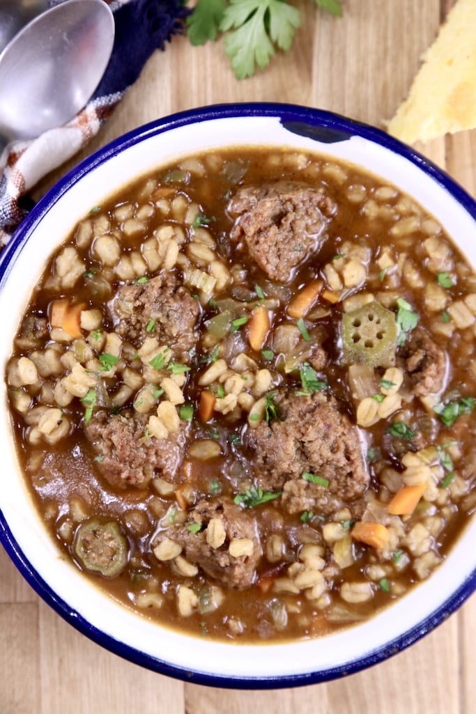 closeup of bowl of smoked sausage barley soup 