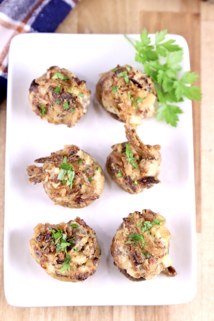 overhead view of sausage stuffed mushrooms on a platter