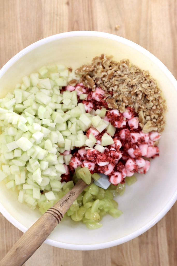 Bowl with cranberries, apples, grapes and walnuts