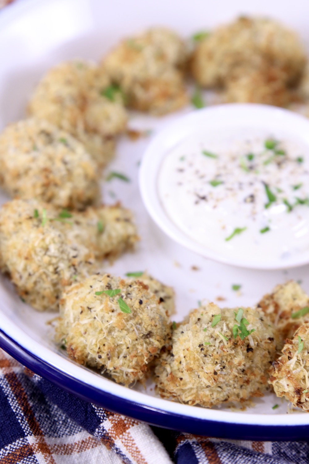 Air Fryer Mushrooms on a platter with ranch dressing