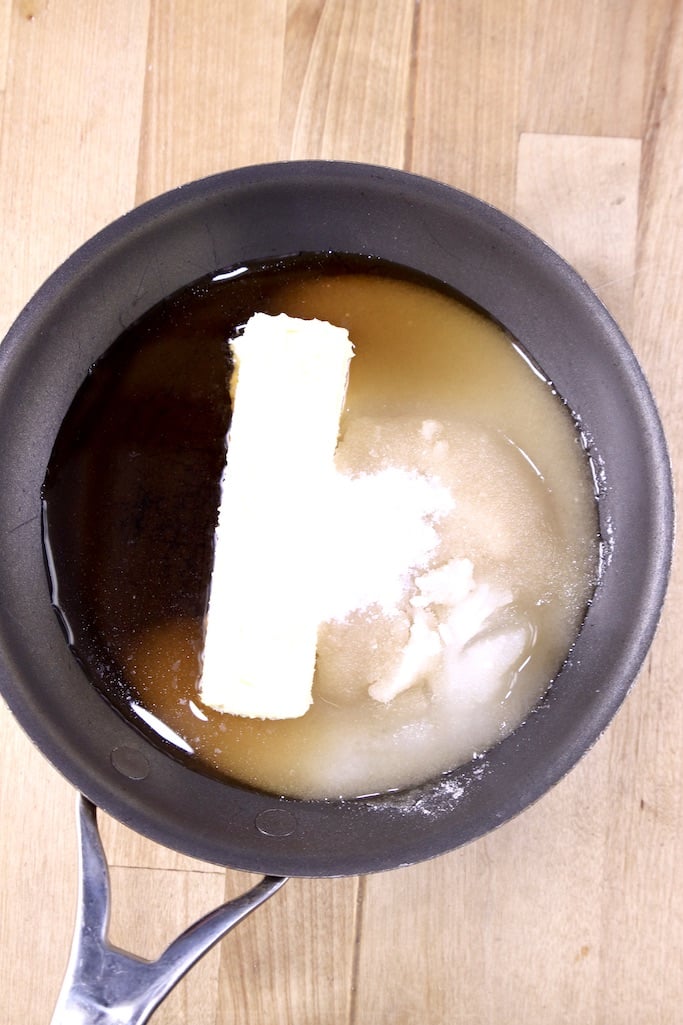 small skillet with rum, butter and sugar