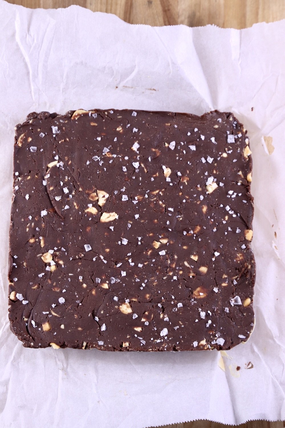 Parchment lined pan of cashew fudge