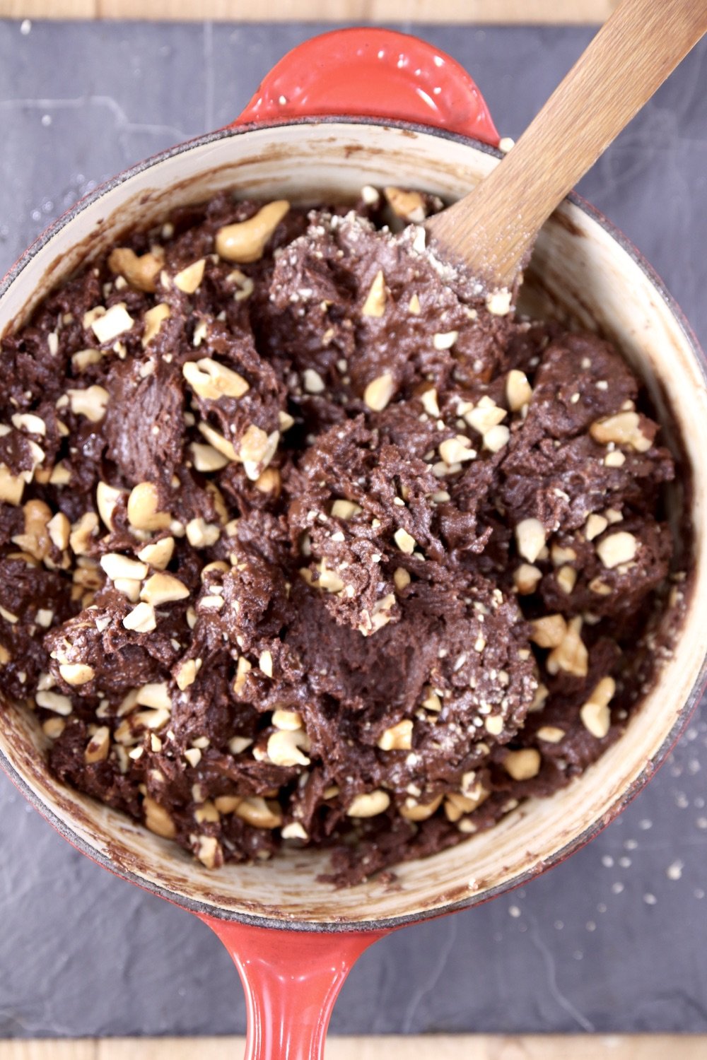 Pan of cashews mixed into chocolate fudge