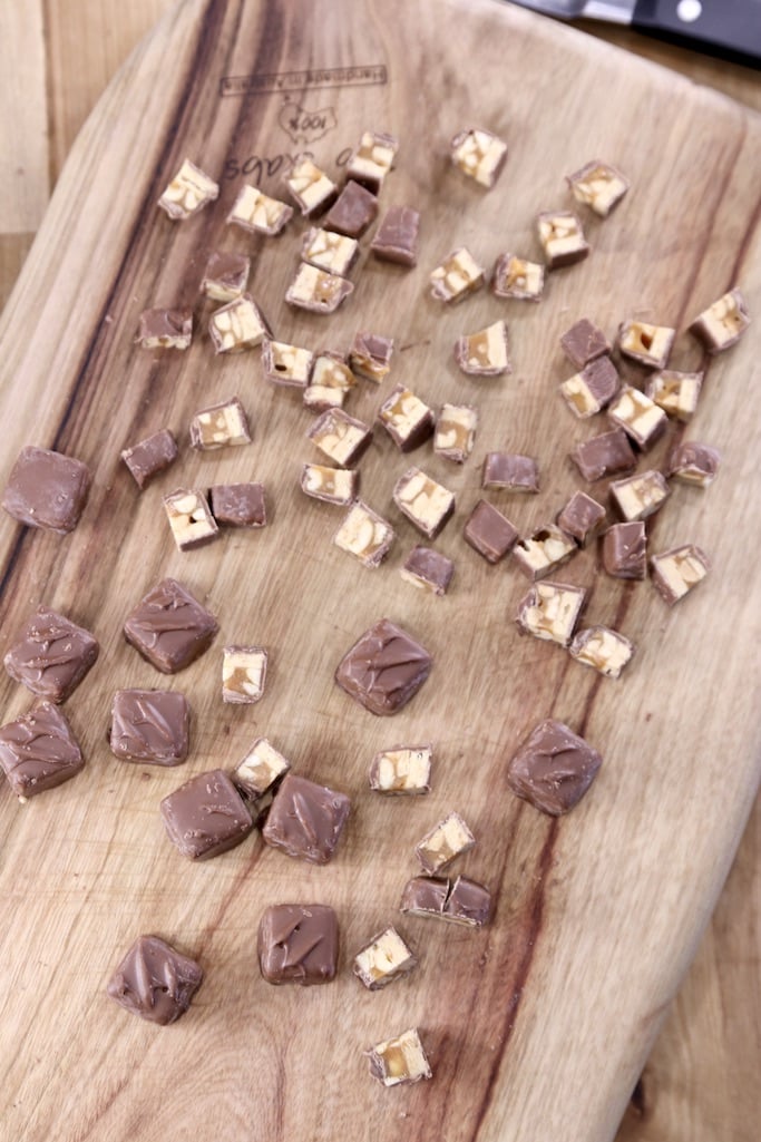 Chopped Snickers Minis on a cutting board