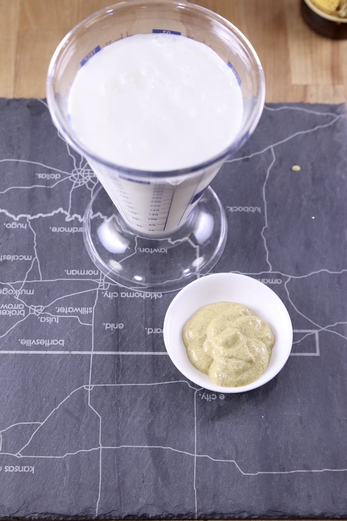 Cream and milk in a beaker measure, small bowl of brown mustard
