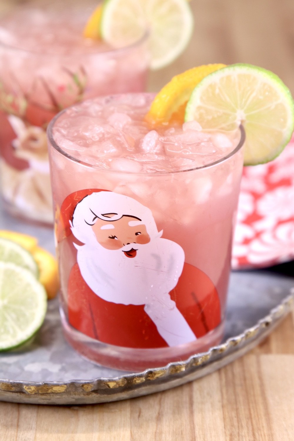 Cranberry Punch in a Christmas Glass garnished with lime and orange slices