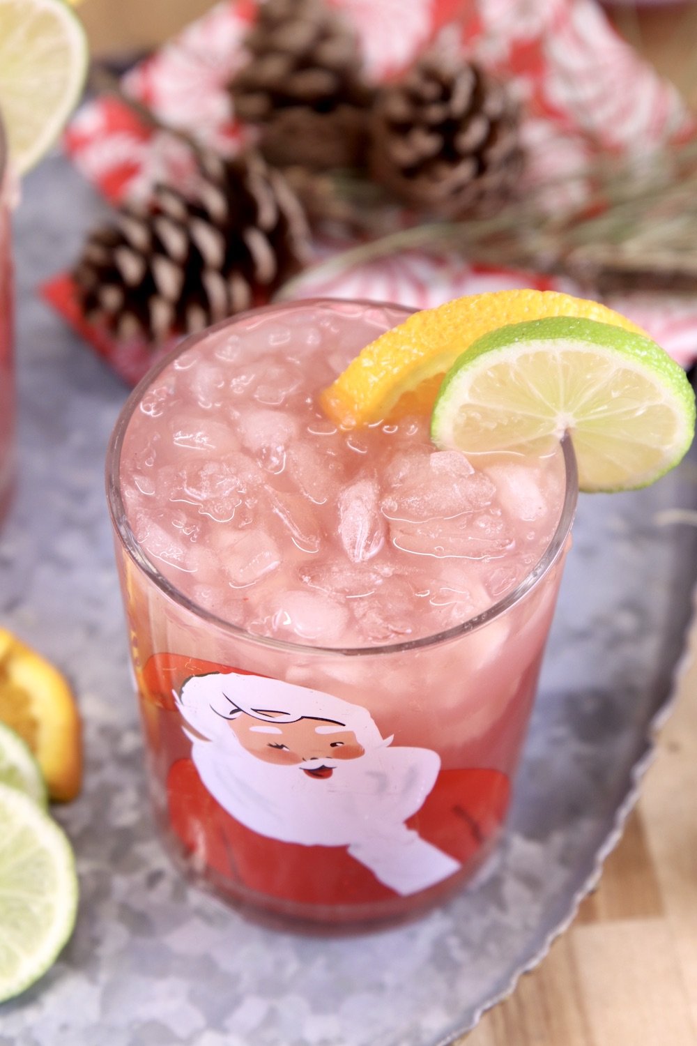 Cranberry Orange Punch on a tray with pinecones
