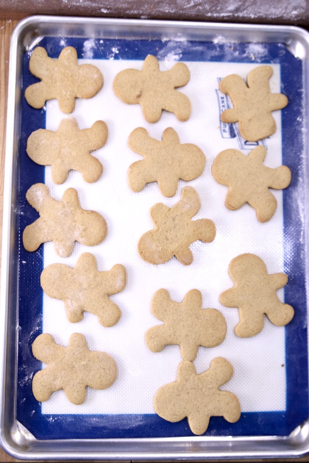 baked gingerbread men cookies on a cookie shhet