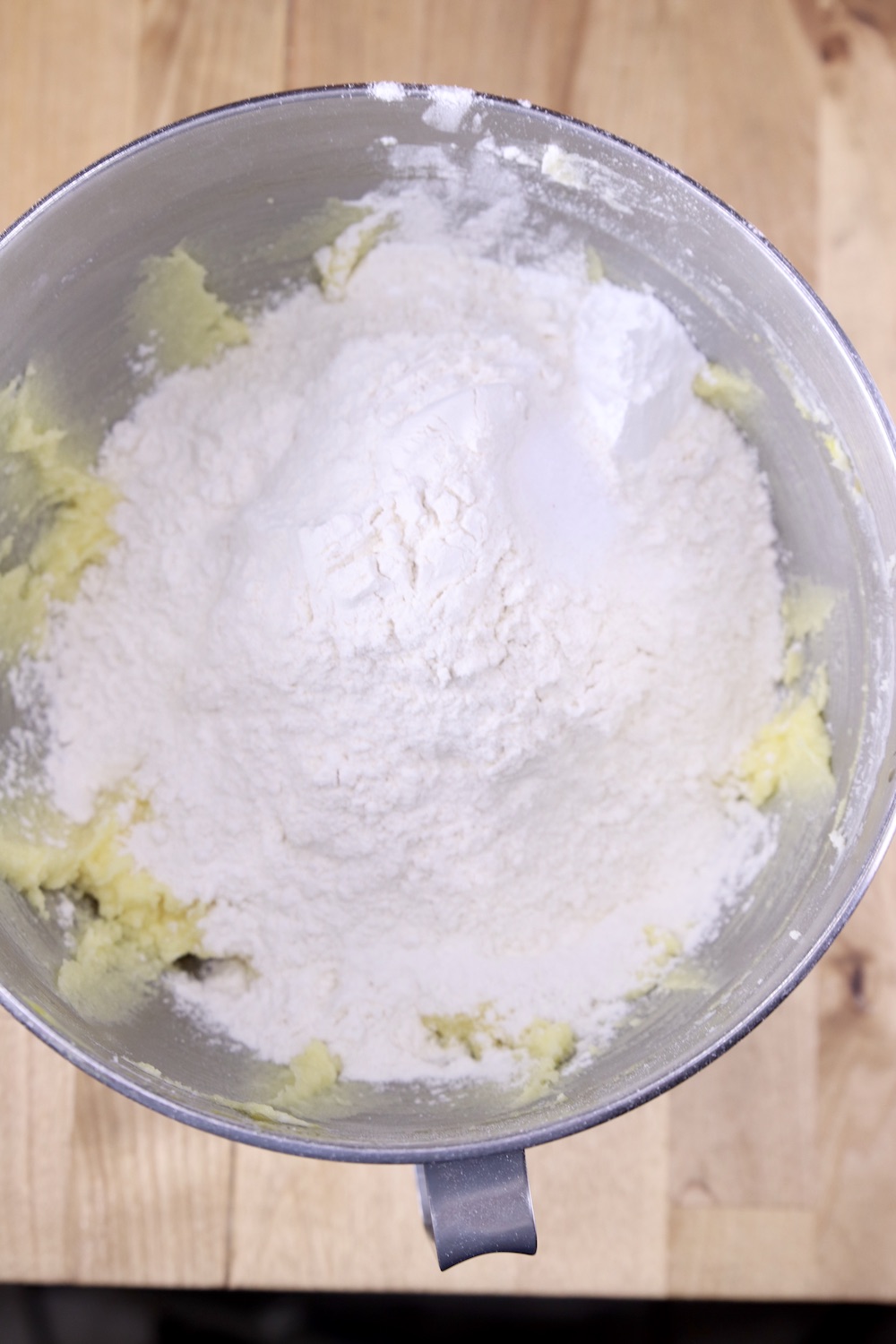 Mixer bowl with flour added for cookie dough