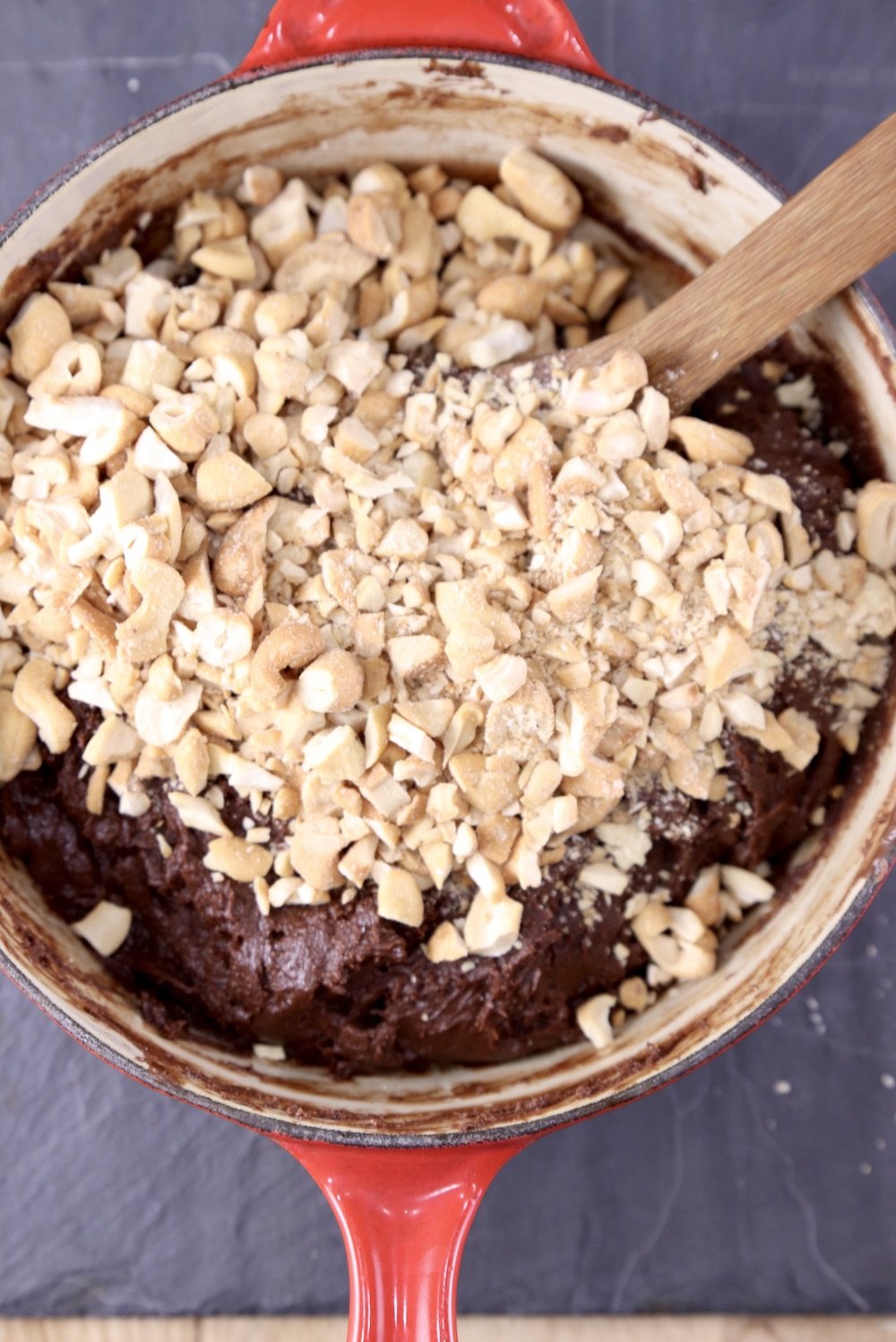 Pan of chocolate fudge with chopped cashews
