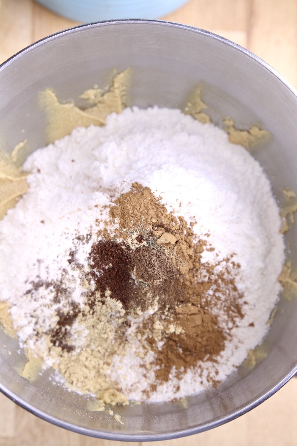 Mixer bowl with flour and spices for gingerbread cookies