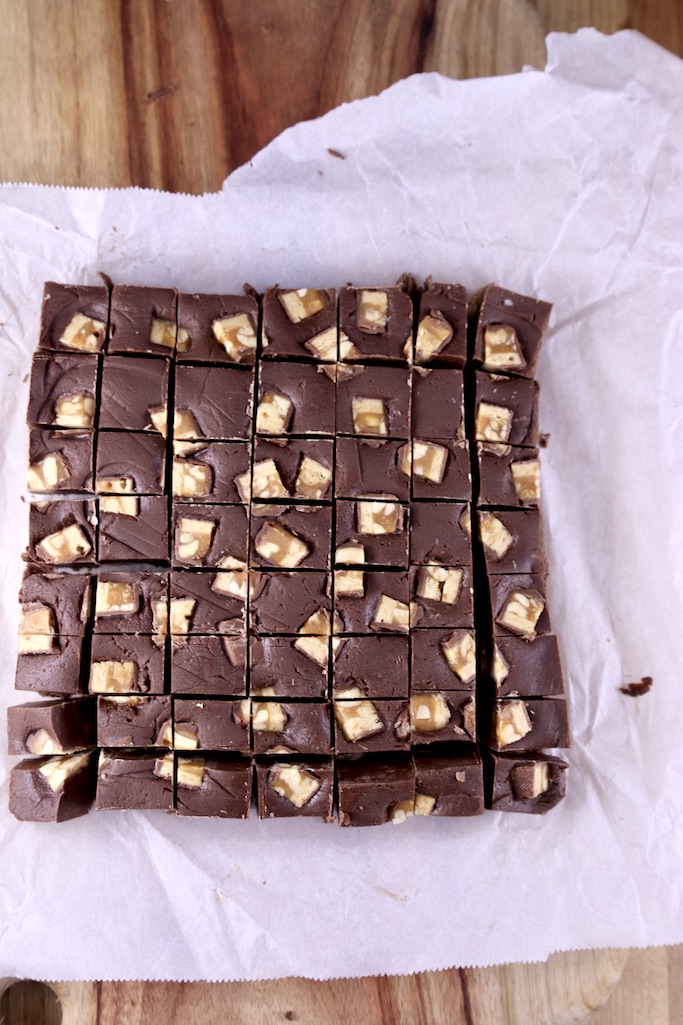 Sliced Snickers Fudge on Parchment Paper