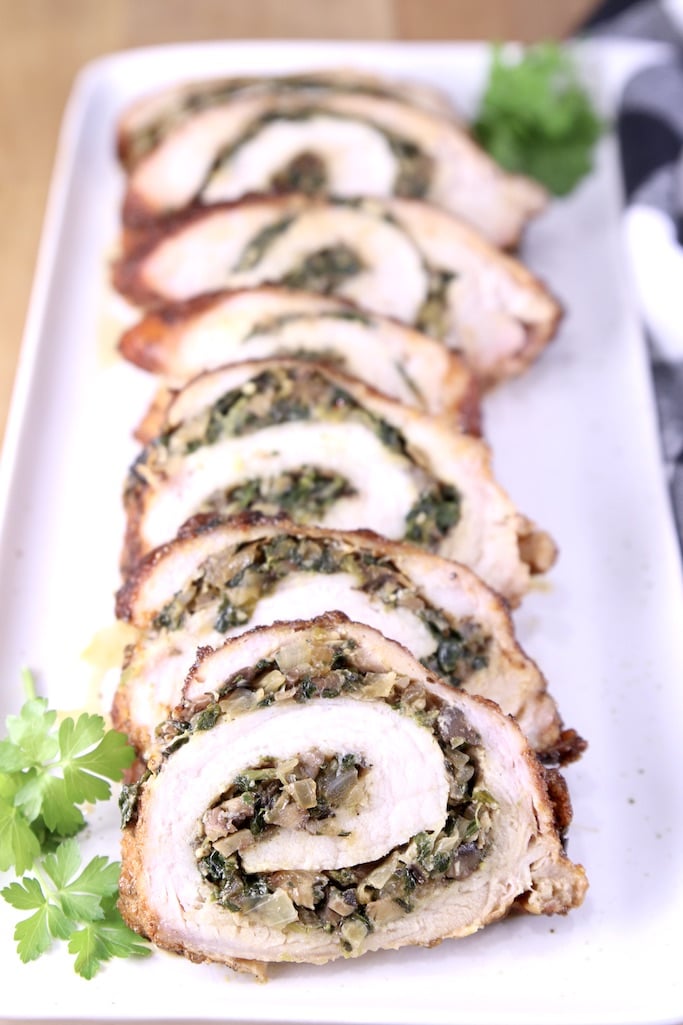 platter of slices of stuffed pork tenderloin