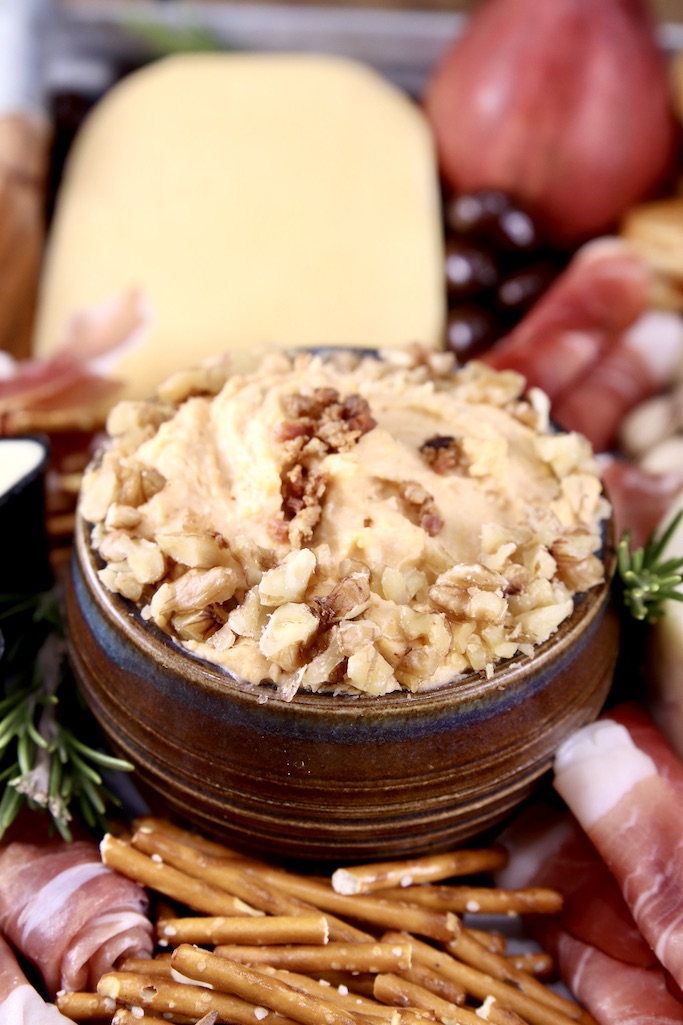 Bacon Beer Cheese Dip on a charcuterie board