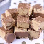 Peanut Butter Cup Fudge stacked on a polka dot baking sheet