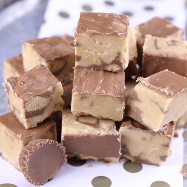 Peanut Butter Cup Fudge stacked on a polka dot baking sheet