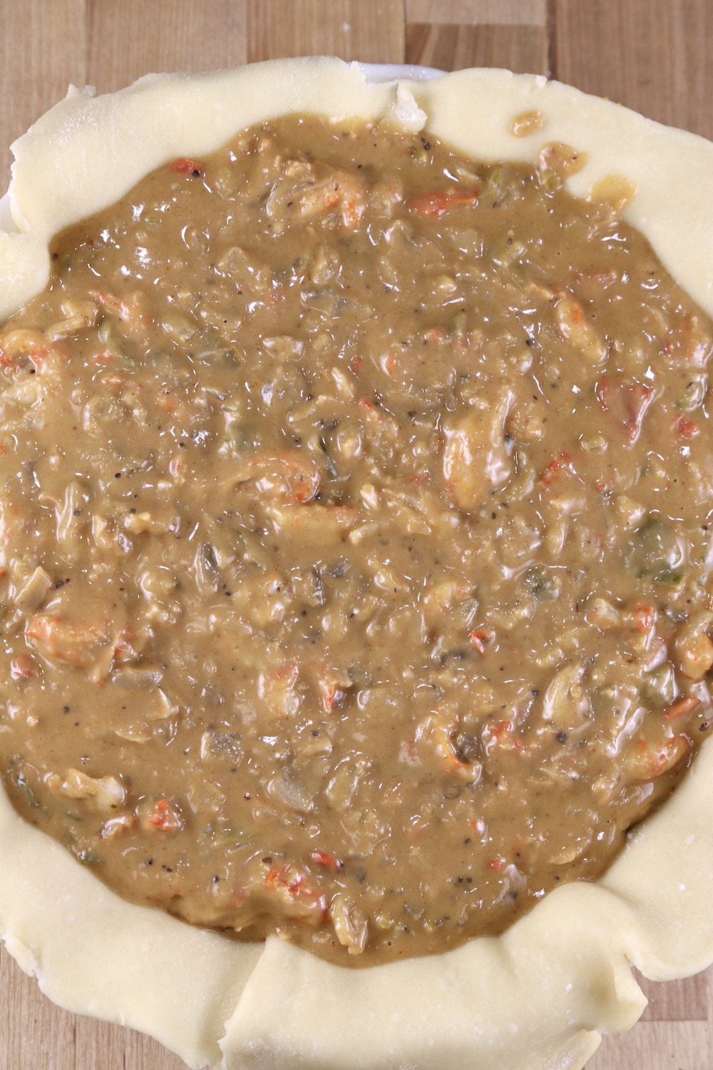 Pie crust filled with crawfish pie filling