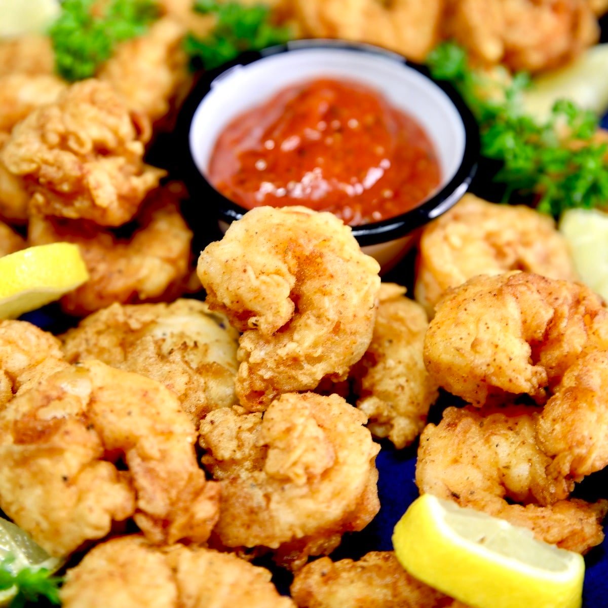 Fried shrimp with cocktail sauce.