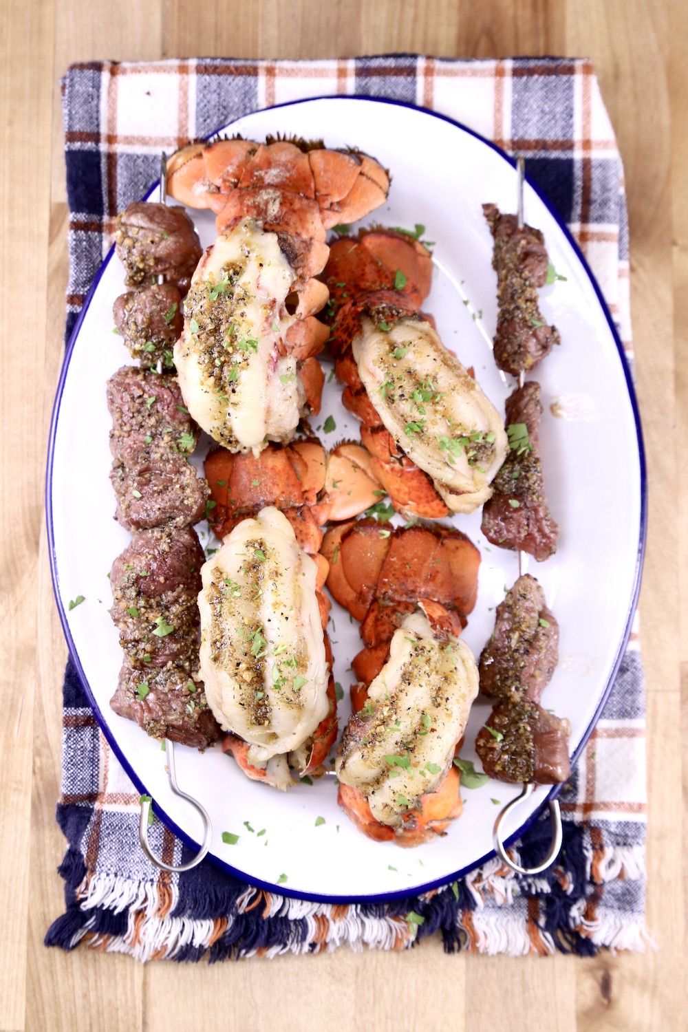 Lobster Tails with Steak bites on a platter