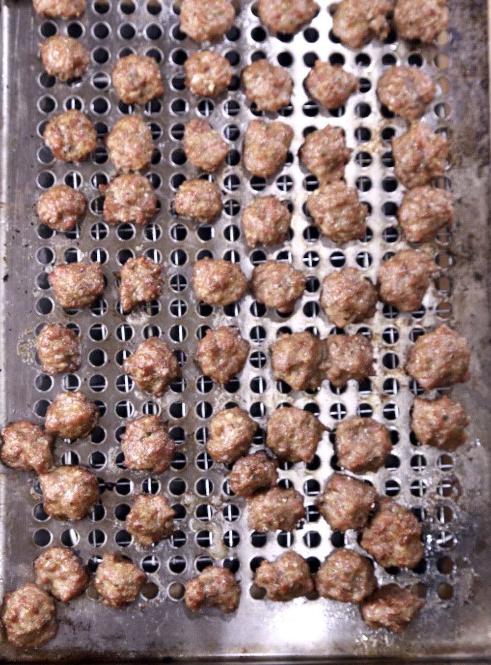 Grilled meatballs on a grill pan - overhead view
