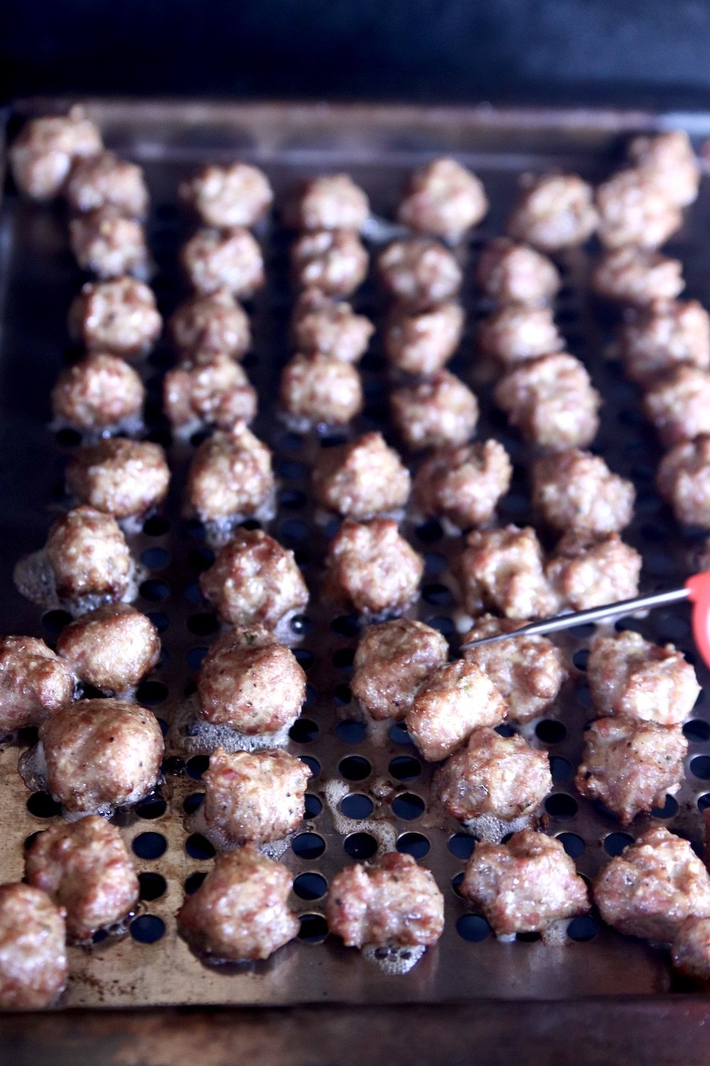 meatballs on a grill pan on the grill