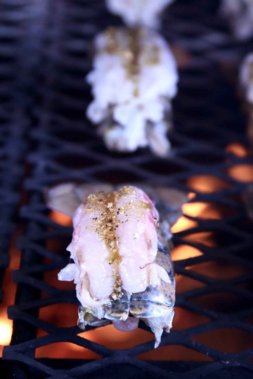 Lobster tails over a grill fire