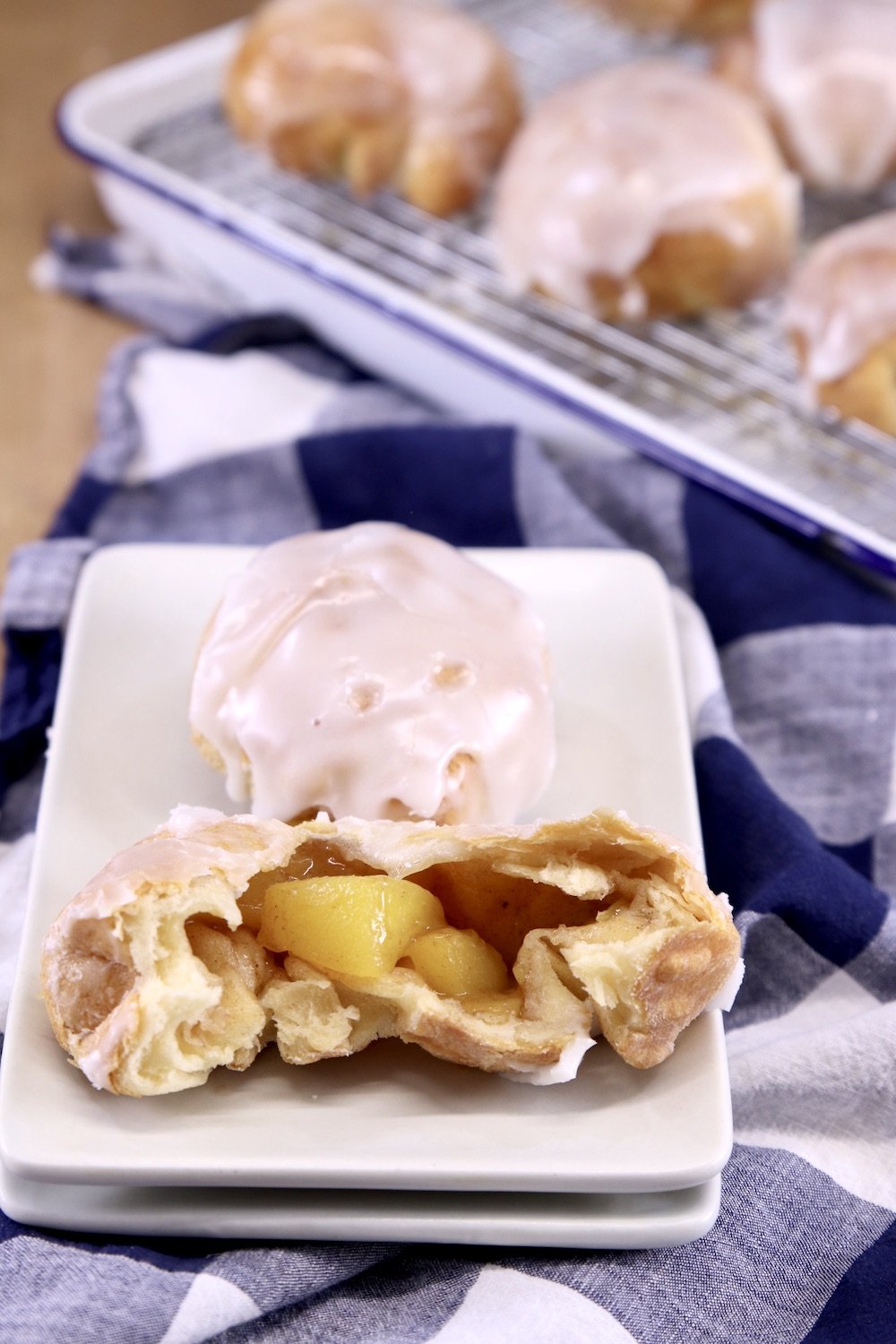 Dessert plate of peach cobbler bomb dessert with powdered sugar glaze. 