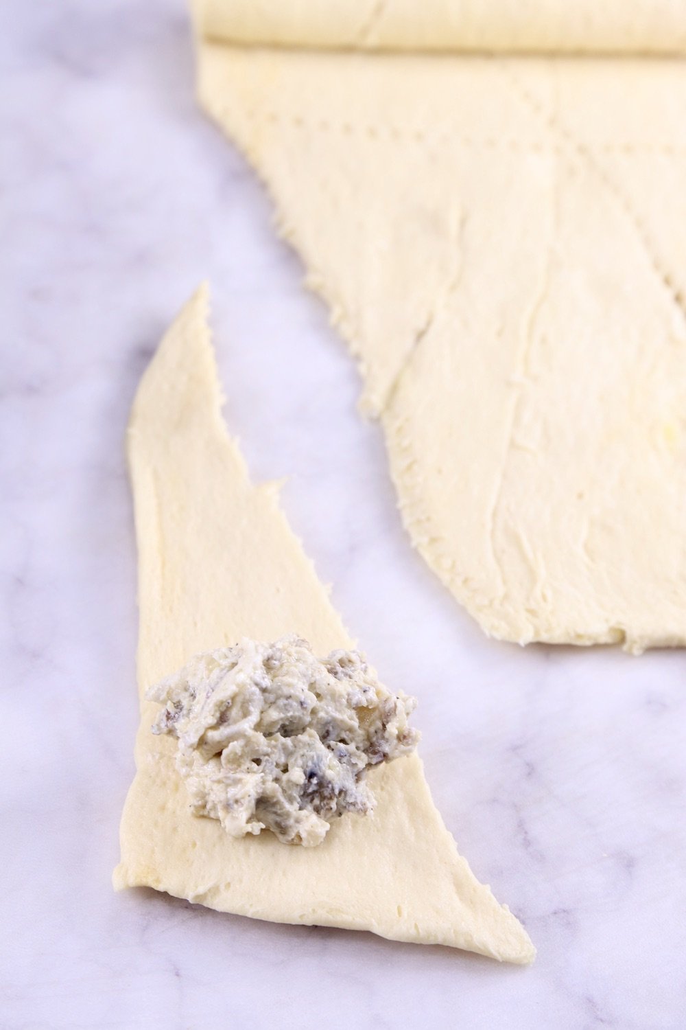 crescent dough triangles stuffed with sausage mixture
