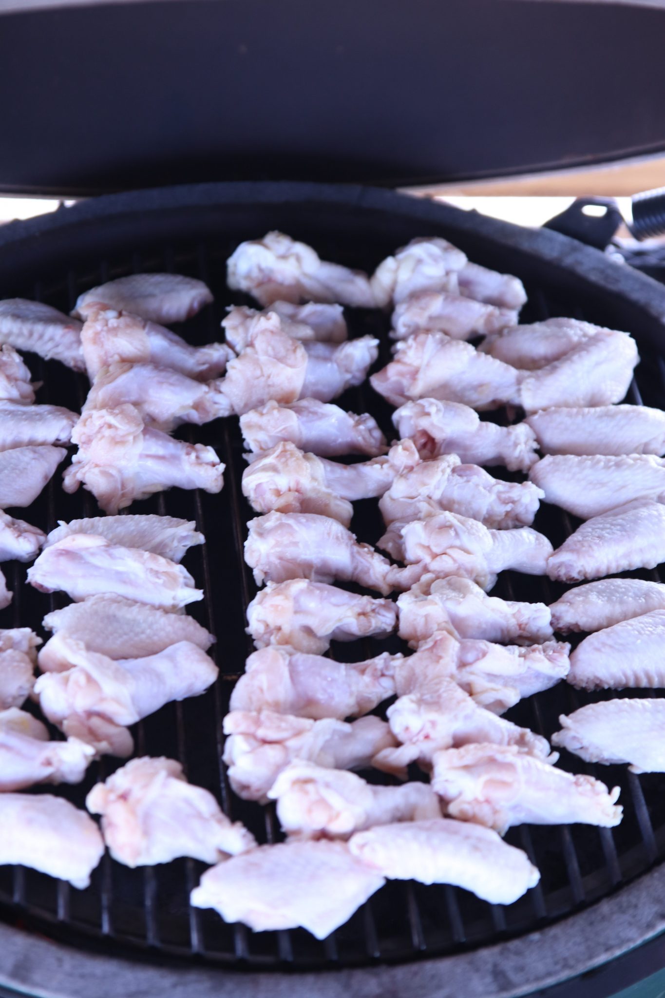 grill filled with chicken wings