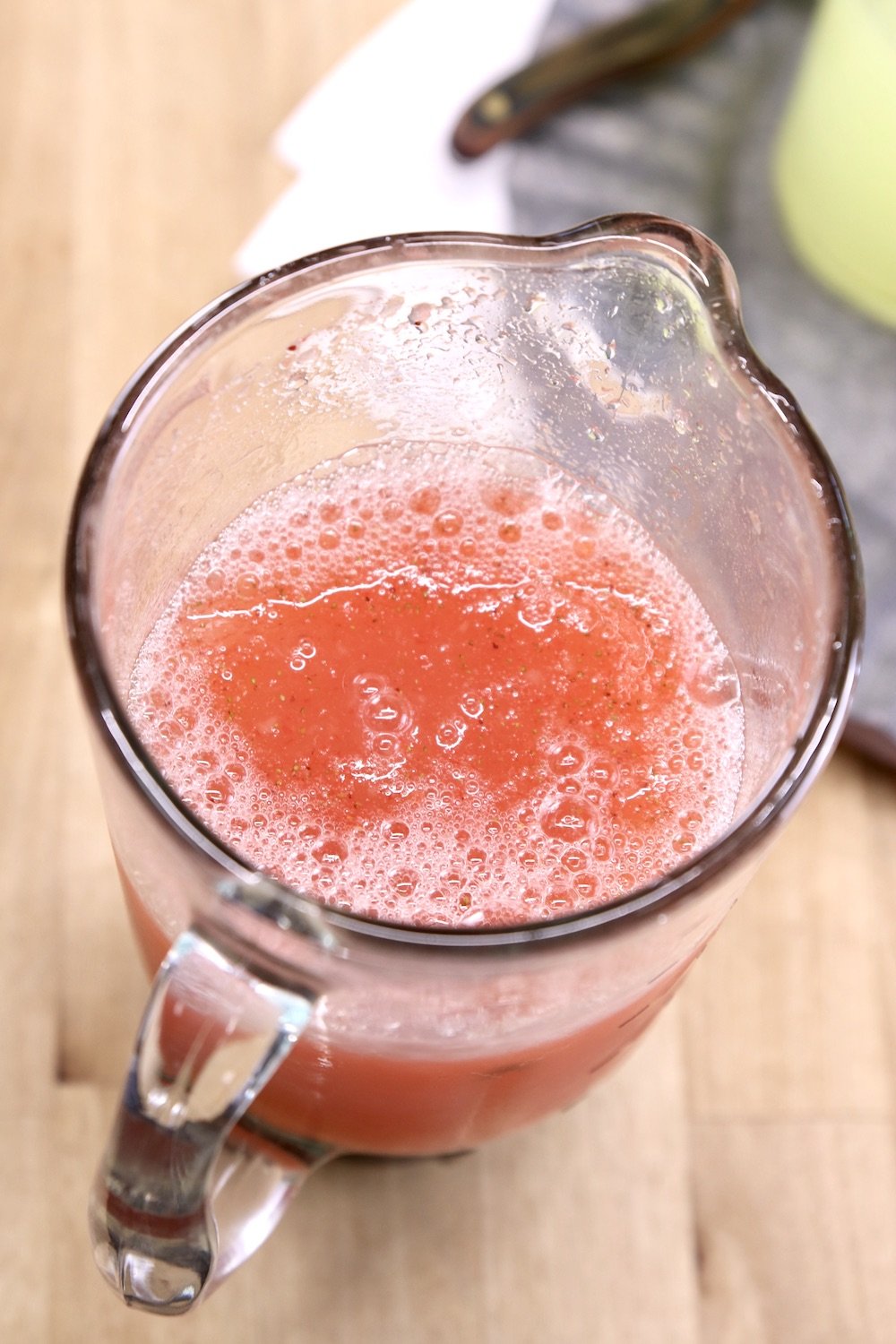 blender cup with strawberry lemonade