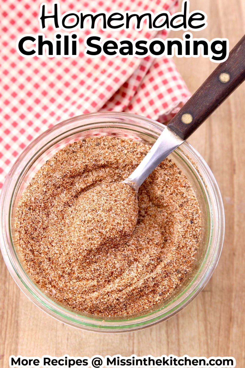 bowl of homemade chili seasoning with a spoon