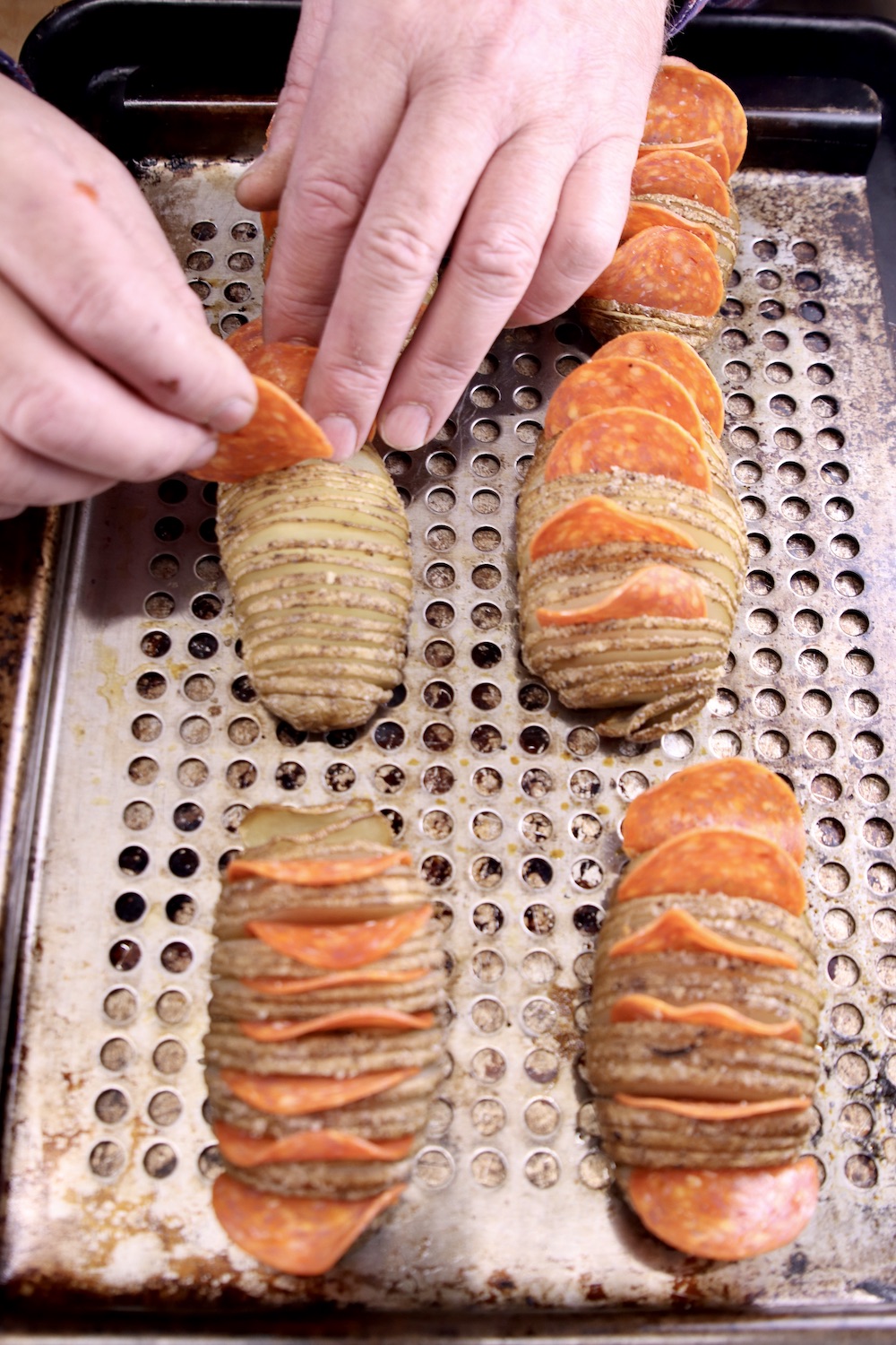 Stuffing hassleback potatoes with pepperoni