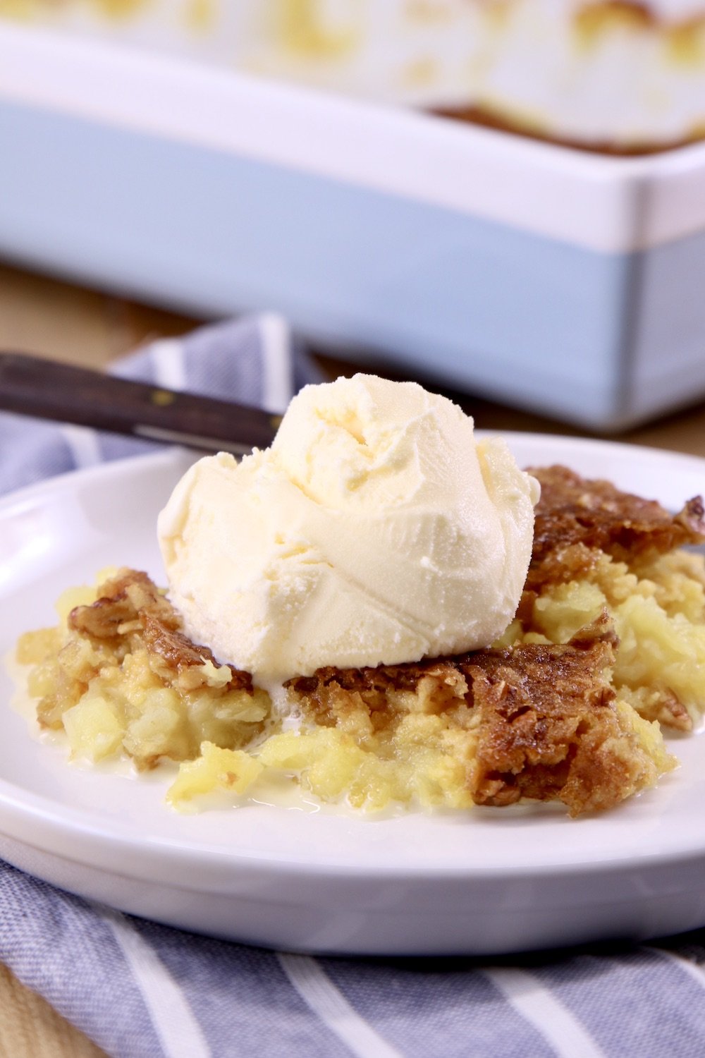 Pineapple Dump Cake served with vanilla ice cream