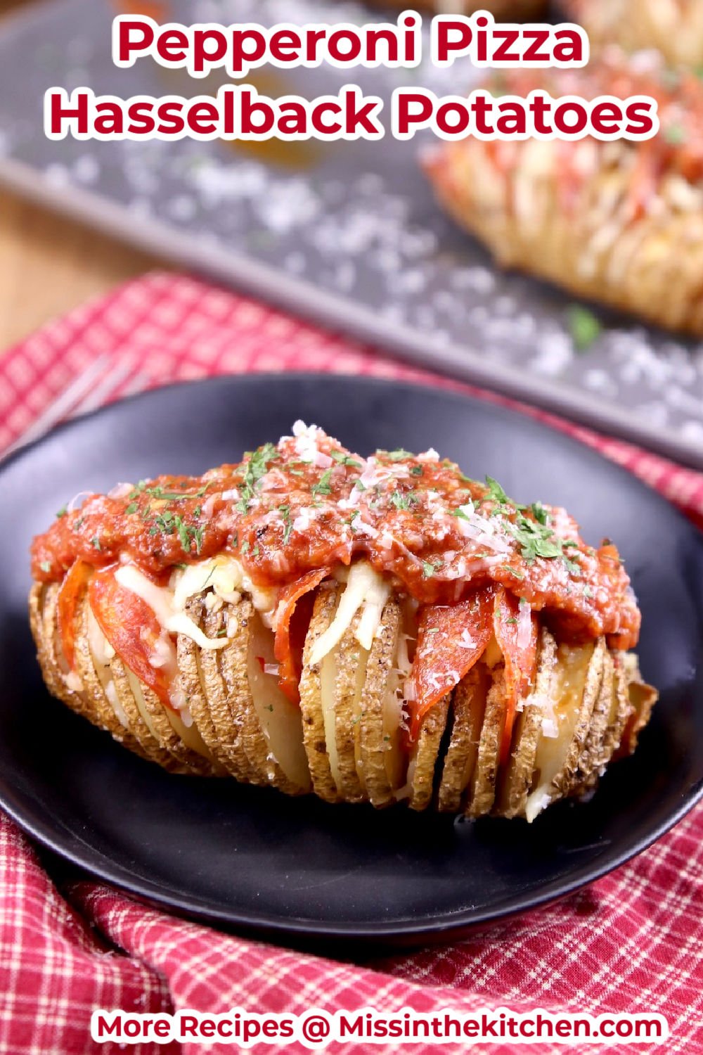 Pepperoni Pizza Hasselback Potato on a black bowl - red napkin - text overlay
