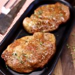 Apricot Pork Chops on a black platter
