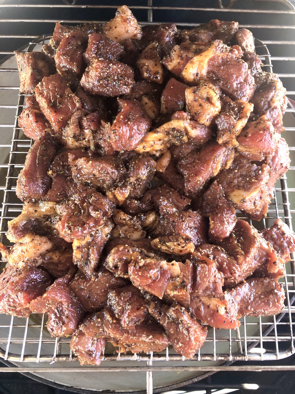 wire rack on a Dutch Oven topped with Sirloin roast chunks