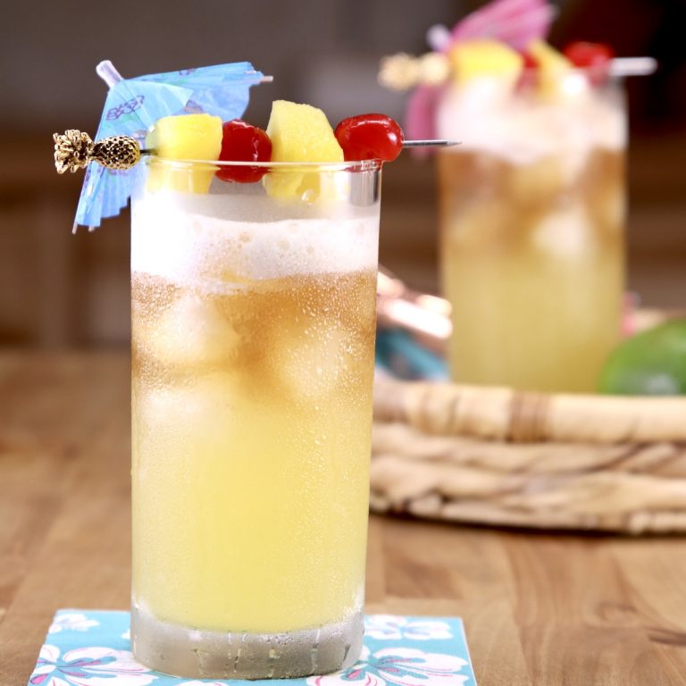 Pineapple Mai Tai Cocktail with pineapple and cherry garnish