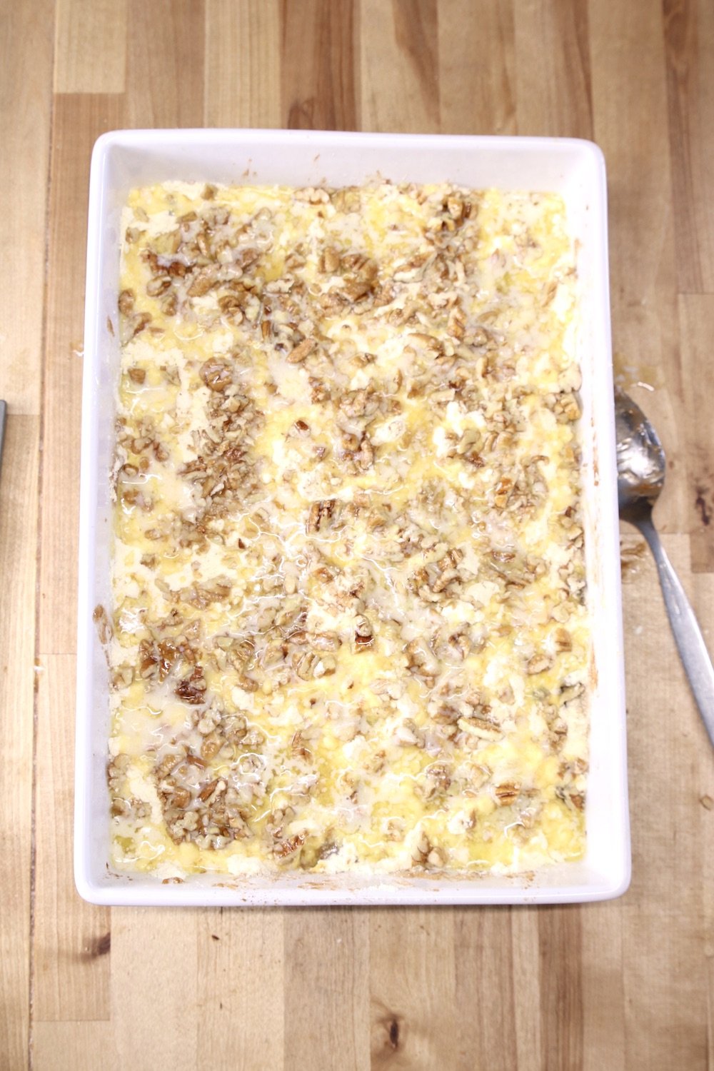 melted butter poured over apple pie filling