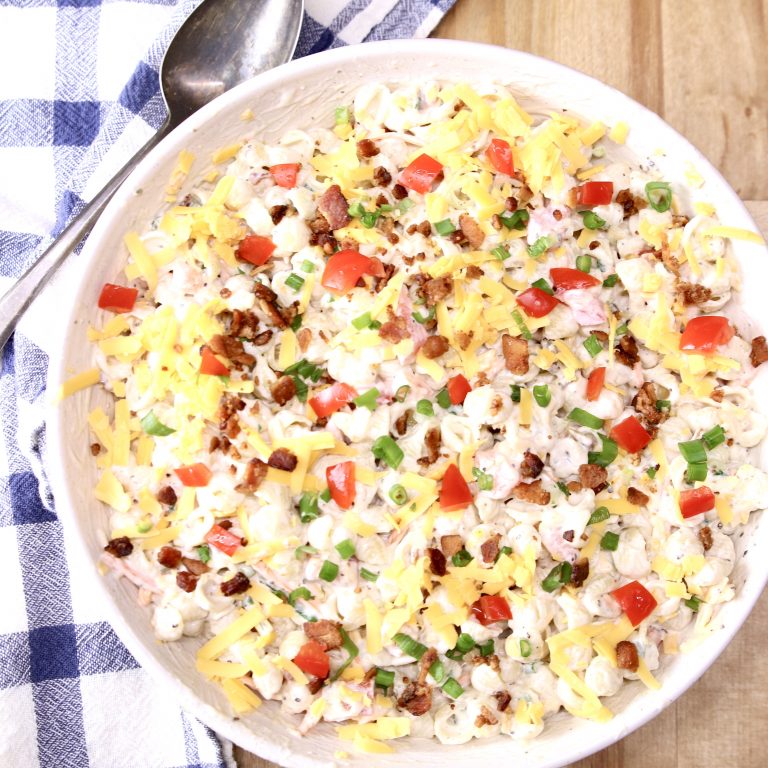 bowl of pasta salad with bacon, tomatoes and green onions