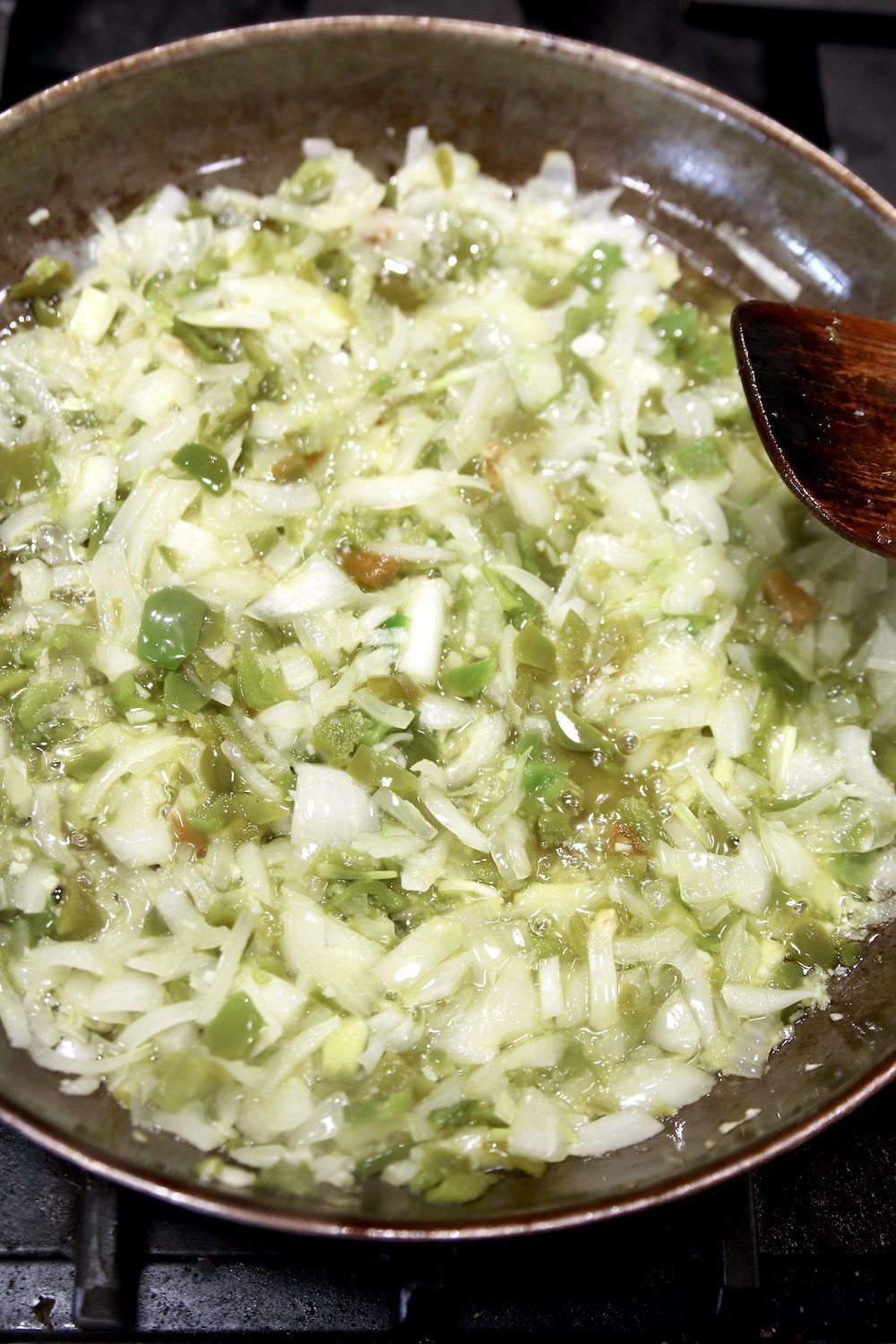 cooking onions and bell peppers in a skillet
