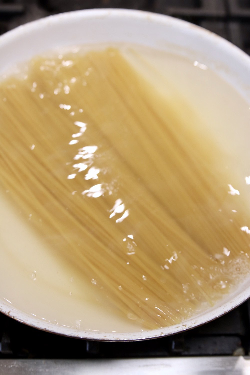 boiling spaghetti in pan