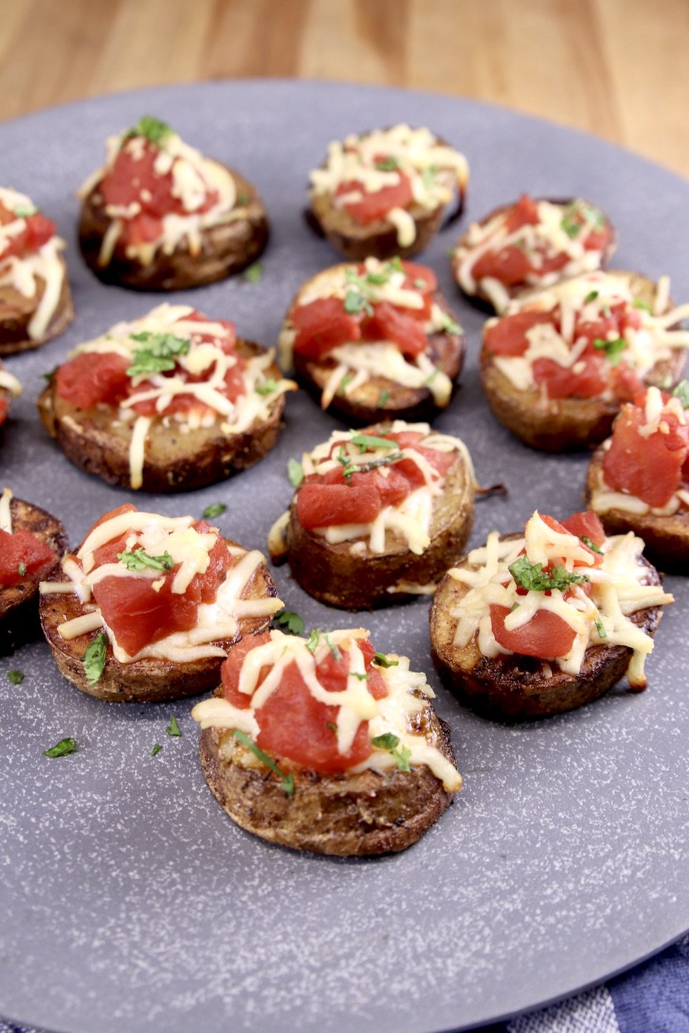 Bruschetta Butter Potatoes on a gray plate