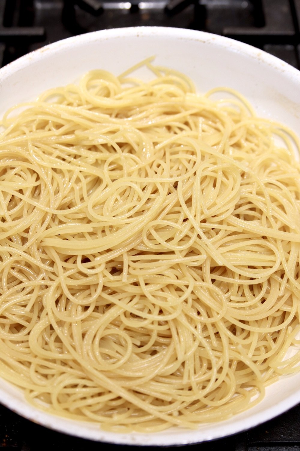 drained spaghetti in a pan