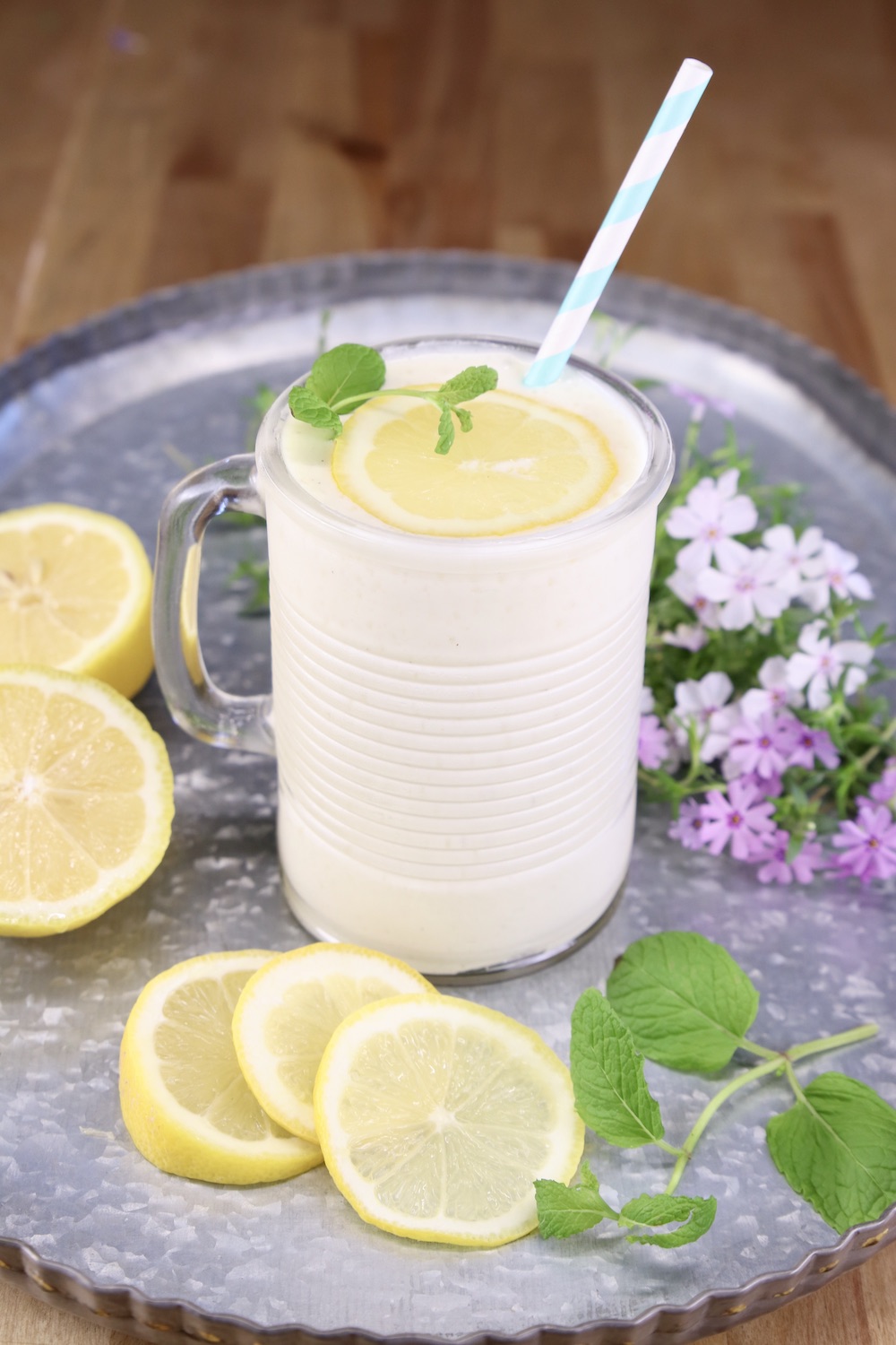 glass of pineapple lemonade frosty on a tray